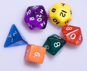 Collection of multi-sided, colorful dice.